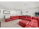 Open game room with a red sectional sofa, wet bar, pool table, and arcade game at 3868 Whitewood Ct, Oviedo, FL 32766