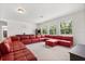 Spacious game room with a large red sectional, pool table, and arcade game at 3868 Whitewood Ct, Oviedo, FL 32766