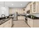 Bright kitchen with granite countertops and stainless steel appliances at 3868 Whitewood Ct, Oviedo, FL 32766