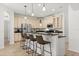 Kitchen featuring granite countertops, stainless steel appliances, and bar seating at 3868 Whitewood Ct, Oviedo, FL 32766