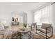 Inviting living room with modern furnishings and an open view to the dining area at 3868 Whitewood Ct, Oviedo, FL 32766