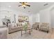 Open living area with modern decor, neutral tones, and view to the kitchen at 3868 Whitewood Ct, Oviedo, FL 32766