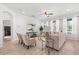 Bright living room with neutral decor, ceiling fan, and plenty of natural light at 3868 Whitewood Ct, Oviedo, FL 32766
