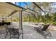 Relaxing screened-in pool area with brick patio, seating, and an attached spa at 3868 Whitewood Ct, Oviedo, FL 32766