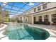 Inviting screened-in pool with an attached spa and ample patio space for entertaining at 3868 Whitewood Ct, Oviedo, FL 32766