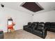 Cozy theater room with tiered seating, a popcorn machine, and a starry ceiling at 3868 Whitewood Ct, Oviedo, FL 32766
