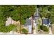 Birds-eye view showing a home with a dark roof, outlined in red, and a grey driveway at 415 S Lancelot Ave, Orlando, FL 32835