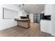 Contemporary eat-in kitchen with breakfast bar, modern appliances, and sliding doors for backyard access at 415 S Lancelot Ave, Orlando, FL 32835