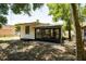 Rear exterior shot featuring a screened in porch at 415 S Lancelot Ave, Orlando, FL 32835