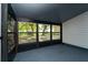 Screened in porch featuring views of the trees and backyard at 415 S Lancelot Ave, Orlando, FL 32835