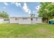 The home has a large backyard with a manicured lawn at 4267 Kirkland Blvd, Orlando, FL 32811