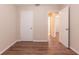 Bedroom features wood-look flooring and a door to the hallway at 4267 Kirkland Blvd, Orlando, FL 32811