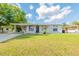 Charming single-story home featuring a well-maintained lawn and a covered carport with space for parking at 4267 Kirkland Blvd, Orlando, FL 32811