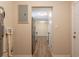 Utility room with hookups, tankless water heater, and view into the kitchen at 4267 Kirkland Blvd, Orlando, FL 32811