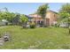 Spacious backyard with a screened-in pool and well-maintained lawn, great for outdoor living at 437 Bridgewater Court, Kissimmee, FL 34758