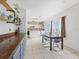 Dining area showcasing a modern light fixture and views of the modern kitchen at 437 Bridgewater Court, Kissimmee, FL 34758