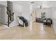 Spacious living room with tile flooring, ceiling fan and stairs to the second floor at 437 Bridgewater Court, Kissimmee, FL 34758