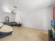 Spacious living room features tile flooring, a comfortable sofa, and a large window for natural light at 437 Bridgewater Court, Kissimmee, FL 34758