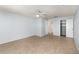 Bright bedroom featuring tile flooring, a ceiling fan, neutral walls, and closet at 450 S Buena Vista Ave, Orlando, FL 32835