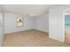 Bright, spacious bedroom featuring tile flooring, a ceiling fan, neutral walls, and large window at 450 S Buena Vista Ave, Orlando, FL 32835