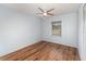 This bedroom features hardwood floors, light walls, a window, and a closet at 450 S Buena Vista Ave, Orlando, FL 32835