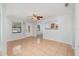 Inviting living room featuring a front door, window, and tiled flooring at 450 S Buena Vista Ave, Orlando, FL 32835