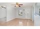 Bright living room featuring tile floors, natural light, and a ceiling fan at 450 S Buena Vista Ave, Orlando, FL 32835