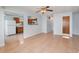 Open-concept living room with tiled flooring and views into the kitchen at 450 S Buena Vista Ave, Orlando, FL 32835