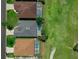 Aerial view displaying the home's roof, pool with screened enclosure, and well-manicured lawn at 468 Jaybee Ave, Davenport, FL 33897