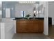 Bathroom features double sinks, wood cabinets and separate tub and shower at 468 Jaybee Ave, Davenport, FL 33897