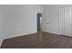 Light and airy bedroom with laminate floors and a door leading to another room at 468 Jaybee Ave, Davenport, FL 33897