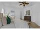 Large primary bedroom with tile floors, ceiling fan and view to the en suite bath at 468 Jaybee Ave, Davenport, FL 33897