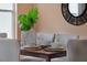 Elegant dining area with seating for four, decorative vase, and round wall mirror at 468 Jaybee Ave, Davenport, FL 33897