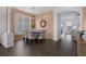 The dining room features laminate flooring and views of the living area at 468 Jaybee Ave, Davenport, FL 33897