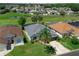 Charming home with lush lawn, mature trees, and landscaping showcasing curb appeal in a serene neighborhood at 468 Jaybee Ave, Davenport, FL 33897
