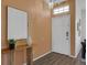 Bright foyer featuring modern decor, attractive laminate flooring, and a convenient security system at 468 Jaybee Ave, Davenport, FL 33897