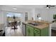Well-appointed kitchen and dining area with seamless indoor/outdoor flow, perfect for entertaining at 468 Jaybee Ave, Davenport, FL 33897