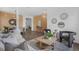 Open concept living space with views of the dining room, laminate flooring, and neutral decor at 468 Jaybee Ave, Davenport, FL 33897