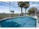 Inviting pool surrounded by a screened-in enclosure, offering relaxing outdoor recreation space at 468 Jaybee Ave, Davenport, FL 33897