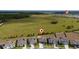 An aerial view showcases the location of a community close to a large green area at 4990 Four Strand Ct, St Cloud, FL 34769