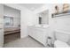 Bright bathroom with double sinks, quartz countertops and a connected bedroom at 4990 Four Strand Ct, St Cloud, FL 34769