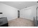 This bedroom has neutral carpet and a large closet, offering a serene and uncluttered space at 4990 Four Strand Ct, St Cloud, FL 34769