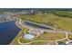 Aerial view of the community pool, parking area and other recreational facilities at 4990 Four Strand Ct, St Cloud, FL 34769