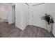 Inviting hallway with tile flooring, a coat closet and views of bathroom at 4990 Four Strand Ct, St Cloud, FL 34769