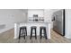 Contemporary kitchen featuring an island, stainless steel appliances, and sleek design at 4990 Four Strand Ct, St Cloud, FL 34769