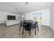 Open-concept living and dining area with modern finishes, natural light, and a seamless flow at 4990 Four Strand Ct, St Cloud, FL 34769