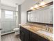 Bathroom features granite countertops, dark cabinetry and a tiled glass shower at 5032 Beach River Rd, Windermere, FL 34786