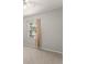 Neutral bedroom with carpet, light walls and a window with blinds and curtain at 5032 Beach River Rd, Windermere, FL 34786