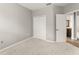 Bedroom featuring neutral walls and carpets, with a closet for plenty of storage at 5032 Beach River Rd, Windermere, FL 34786