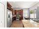 Stylish kitchen with granite countertops, stainless steel appliances, and rich wood cabinets at 5032 Beach River Rd, Windermere, FL 34786